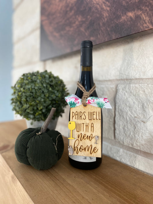 "Pairs well with a new home" Wine tag